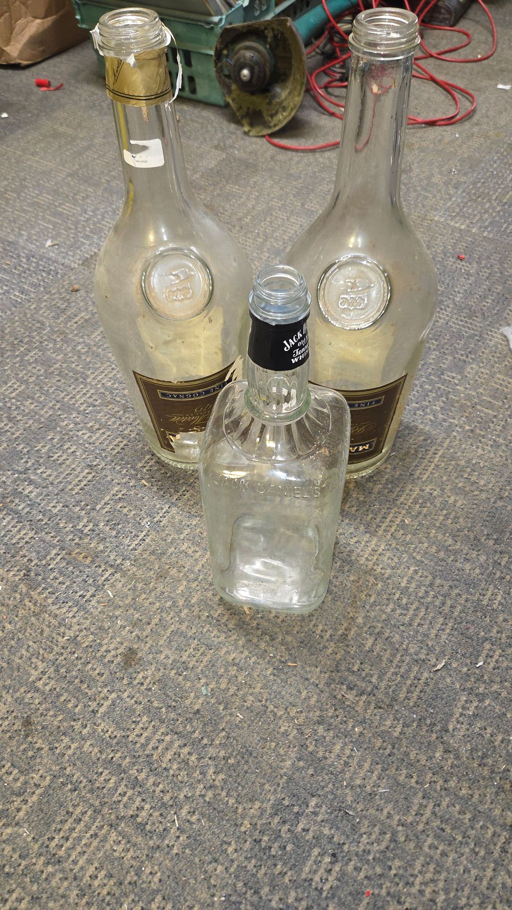 Lot 181 – A Trio of Clear Glass Martell and Jack Daniel’s Bottles
