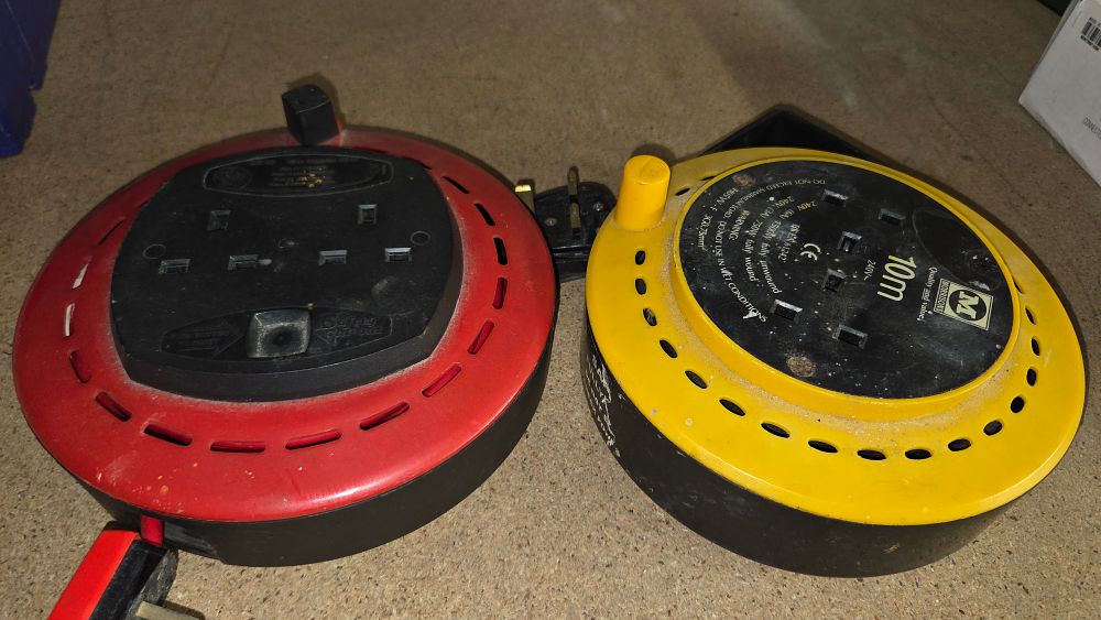 Lot 245 – Two extension cable reels in red and yellow
