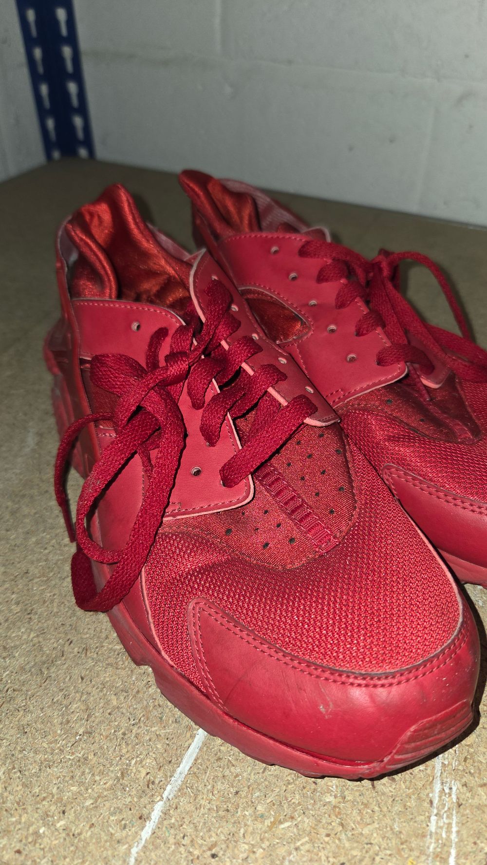Lot 247 – A Pair of Nike Air Huarache Triple Red Sneakers size 9