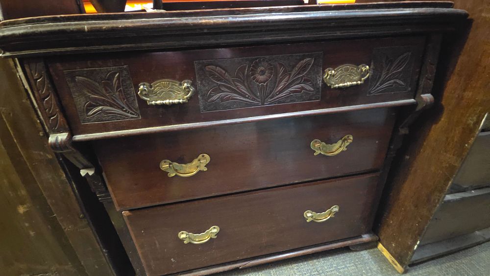 Lot 298 – Dark brown wooden chest of drawers with brass pulls