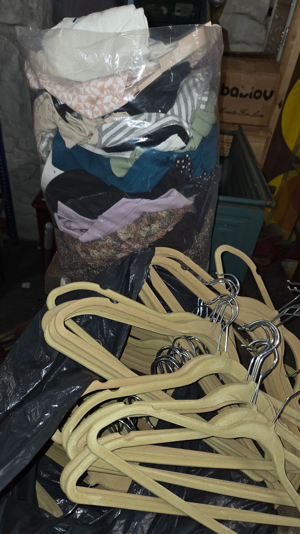 Lot 337 – A Collection of Clothing and Flocked Hangers