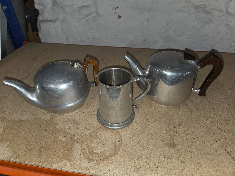 Lot 375 – A Trio of Picquot Ware Teapots and an Inscribed Tankard