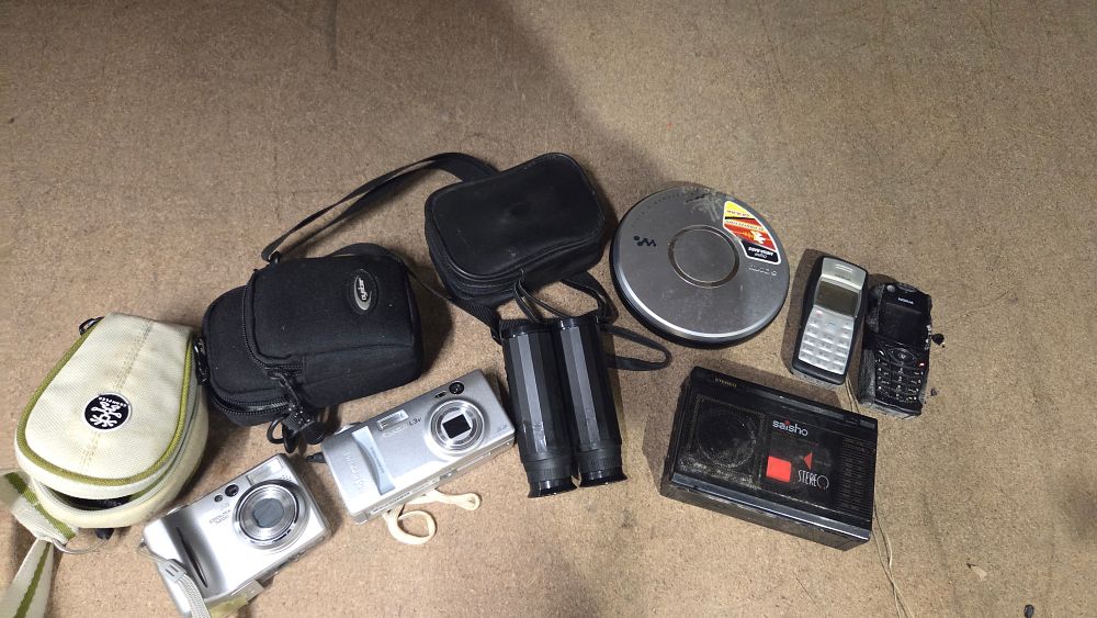 Lot 167 – A Collection of Digital Cameras Binoculars and Portable Electronics