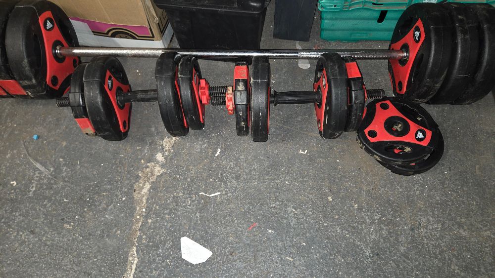 Lot 404 – Adidas Essential Weightlifting Barbell Dumbbell and Plate Collection