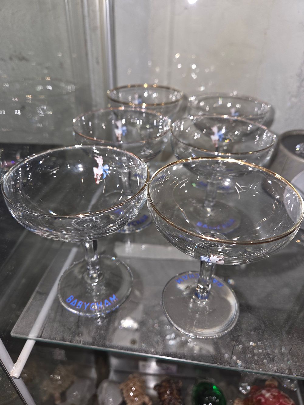 Lot 626 – Several Babycham Clear Glass Champagne Coupes with Gold Rims