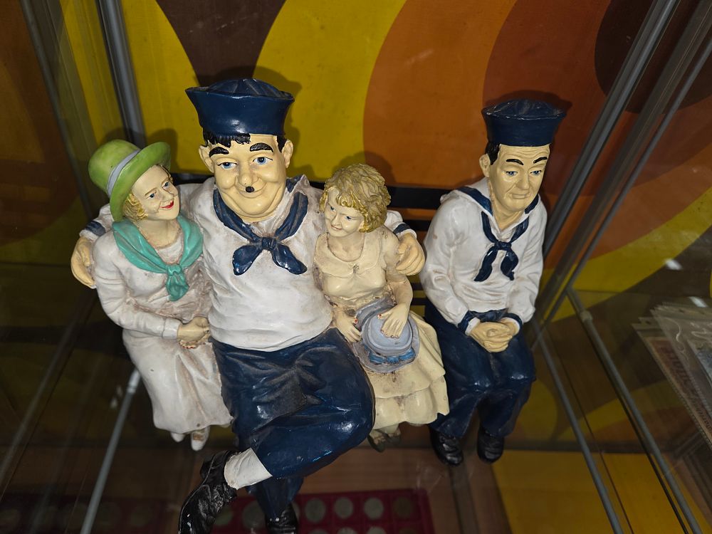 Lot 629 – A Pair of Laurel and Hardy Sailor Shelf Sitting Figurines