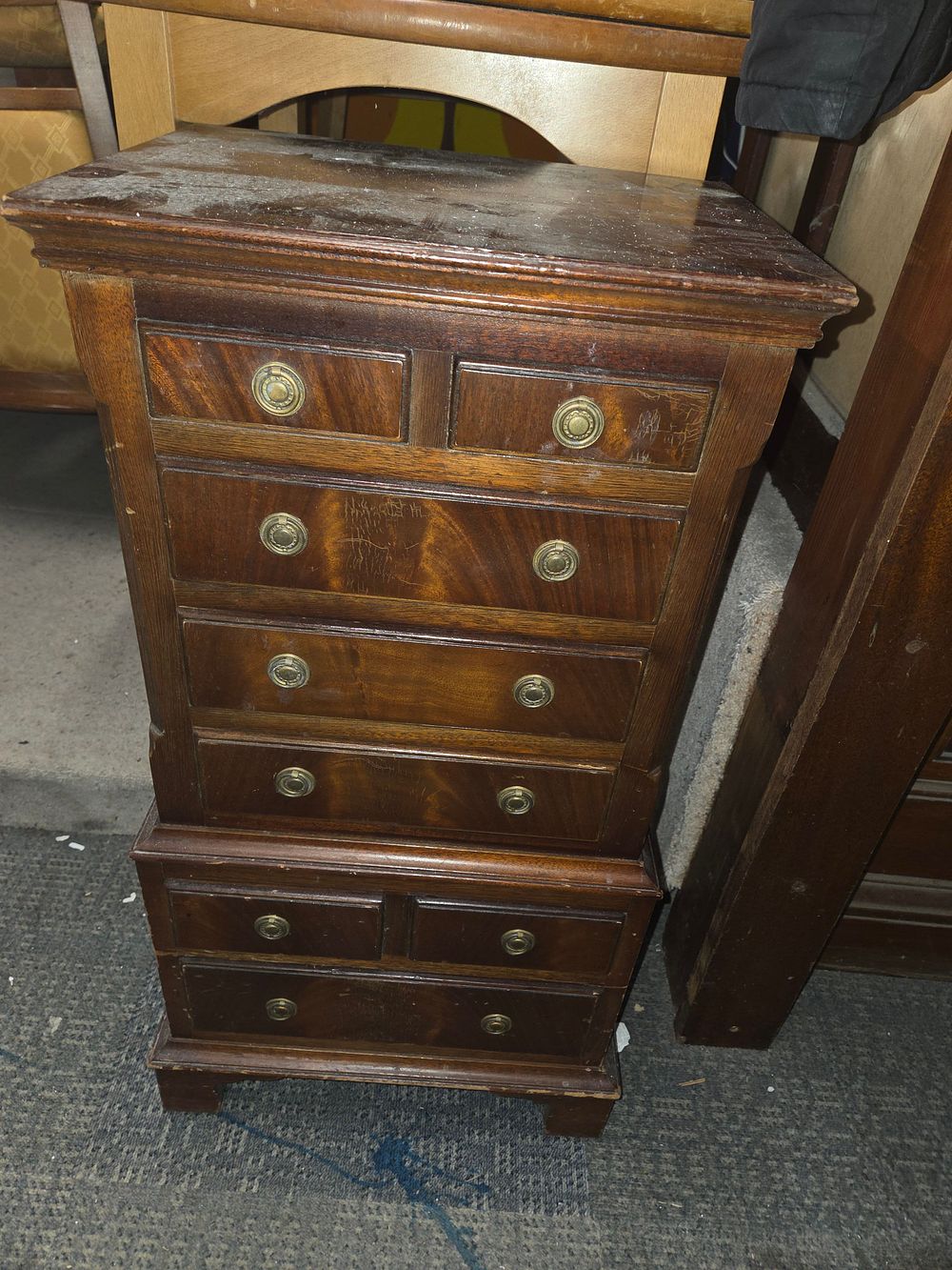 Lot 428 – Dark brown wooden chest of drawers with brass pulls