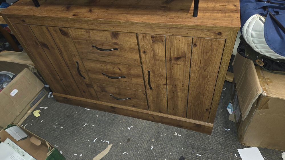 Lot 402 – Brown wood grain sideboard with three drawers and two cabinets