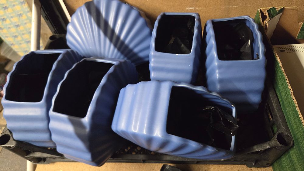 Lot 253 – Six blue ceramic ribbed planters and vases
