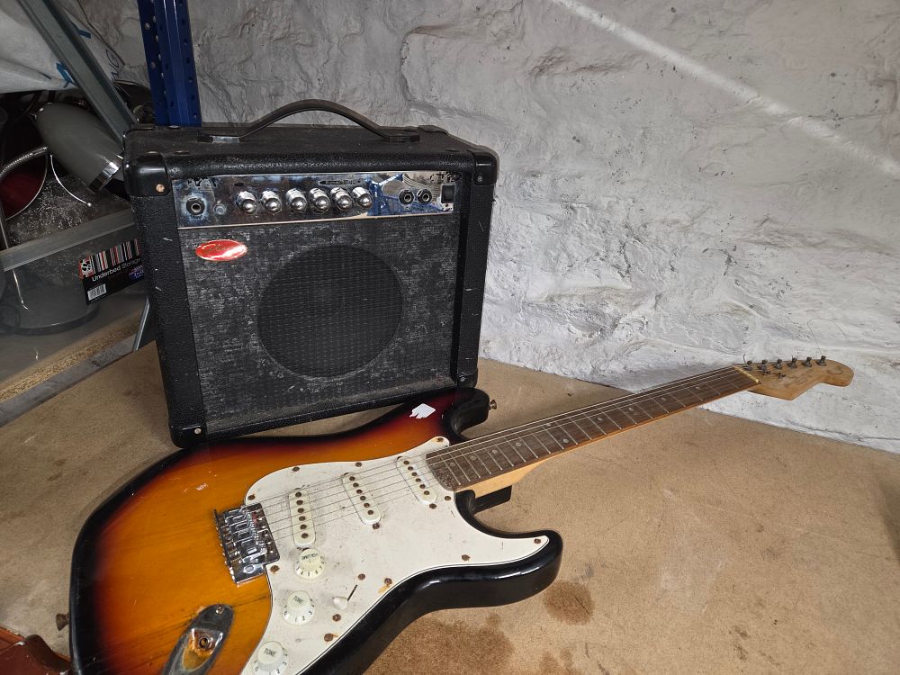 Lot 446 – Two items comprising a Stagg bass amplifier and electric guitar