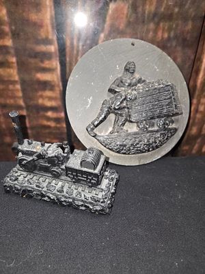Two Welsh Coal and Slate Mining Memorabilia Items. A circular bas-relief plaque and a figurine 