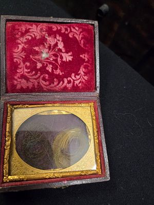 Victorian Embossed Union Case with Mourning Hair Locks. A Victorian-style brown embossed hinged 