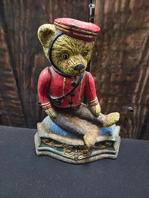 Vintage Cast Iron Teddy Bear Bellhop Door Stop. A painted cast iron door stop in the form of a 