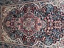 Multi-coloured silk carpet with intricate floral patterns. A multi-coloured silk carpet Image - 1