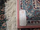 Multi-coloured silk carpet with intricate floral patterns. A multi-coloured silk carpet Image - 2