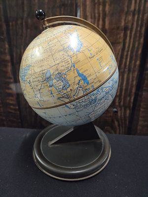 Vintage Chad Valley tabletop terrestrial globe on metal base. A small vintage terrestrial globe 