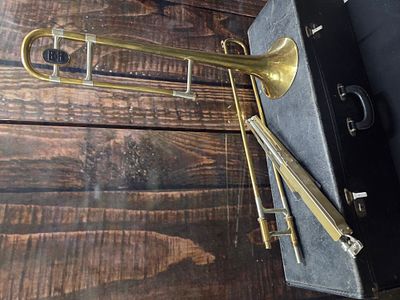 A Boosey & Hawkes Regent Trombone with Mouthpiece and Case. A brass Boosey &amp; Hawkes Regent 