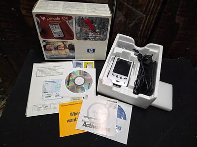 A Collection of HP Jornada 525 Pocket PC and Accessories. A collection of an HP Jornada 525 