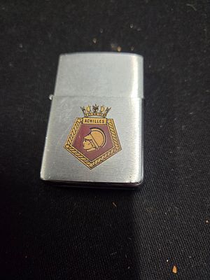 HMS Achilles Orient Express 1983 Zippo Lighter. A silver-toned Zippo lighter featuring the HMS 