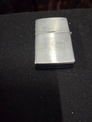 Zippo Silver-Toned Pipe Lighter with Etched Pipe Graphic. A silver-toned Zippo pipe lighter 