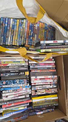 Boz and Bag of DVDs Including Godzilla and Shrek