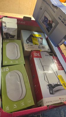 A Collection of Boxed Consumer Electronics and LED Lighting