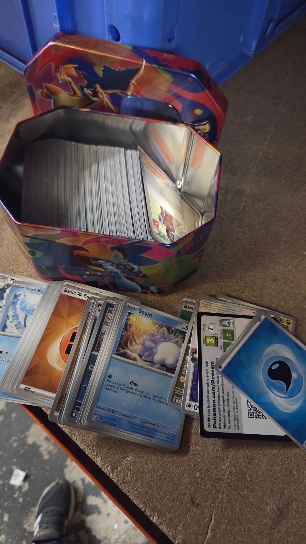 Lot 357 – A Collection of Pokémon Trading Cards and Branded Metal Tin