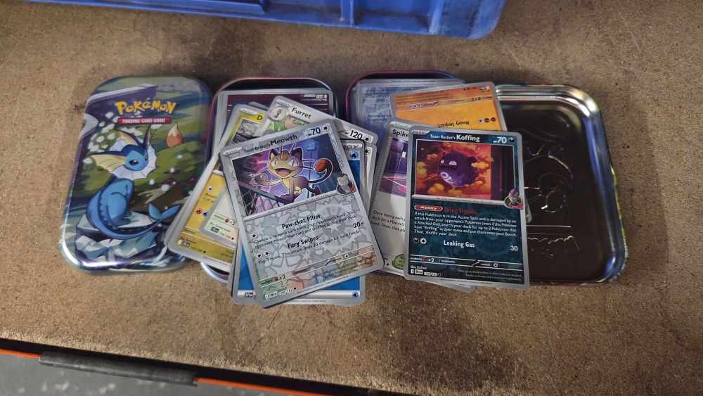 Lot 358 – A Collection of Pokémon Trading Cards and Vaporeon Storage Tin