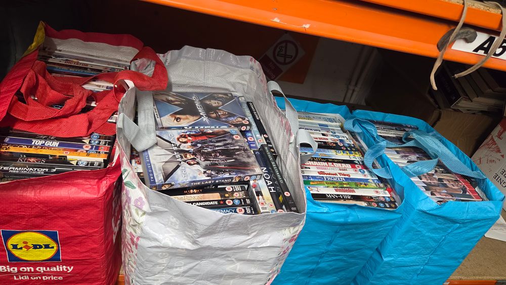 Lot 392 – Four bags containing a collection of assorted DVDs
