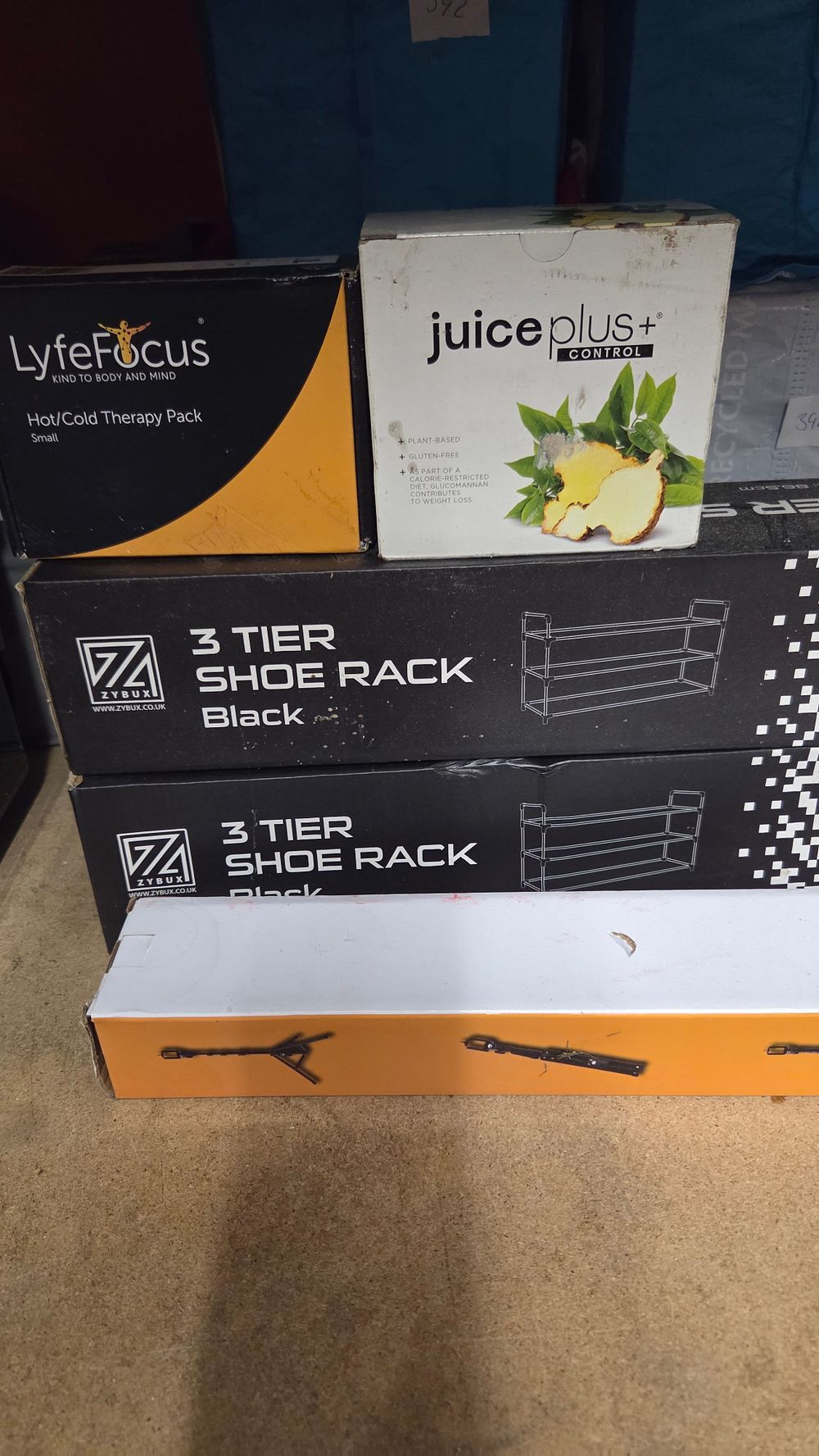 Lot 403 – A Collection of Boxed Household Goods and Shoe Racks