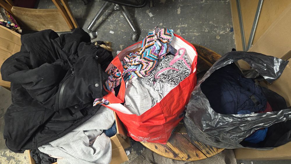 Lot 410 – Box and 2 Bags of Clothing