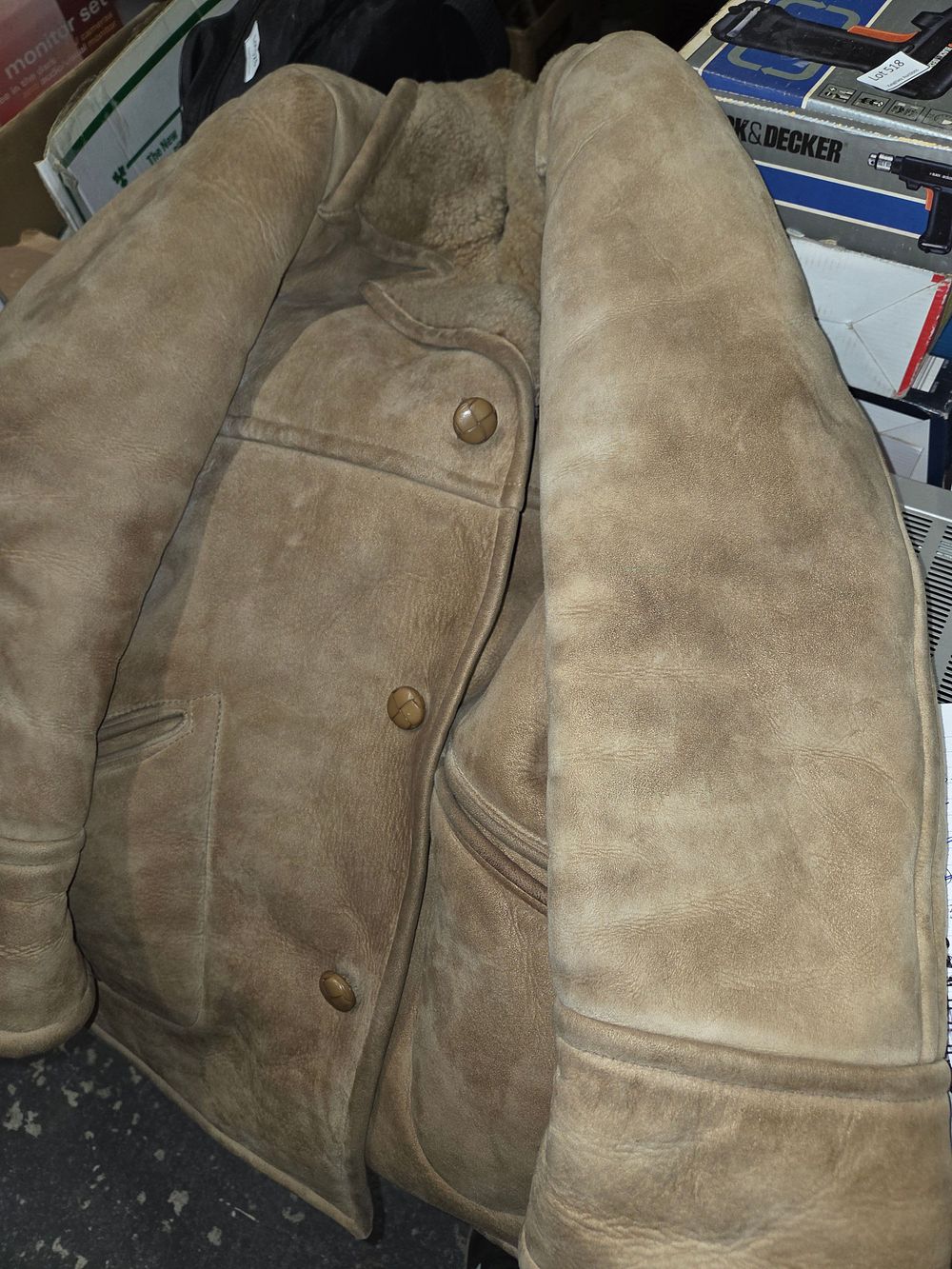 Lot 545 – A tan suede shearling jacket