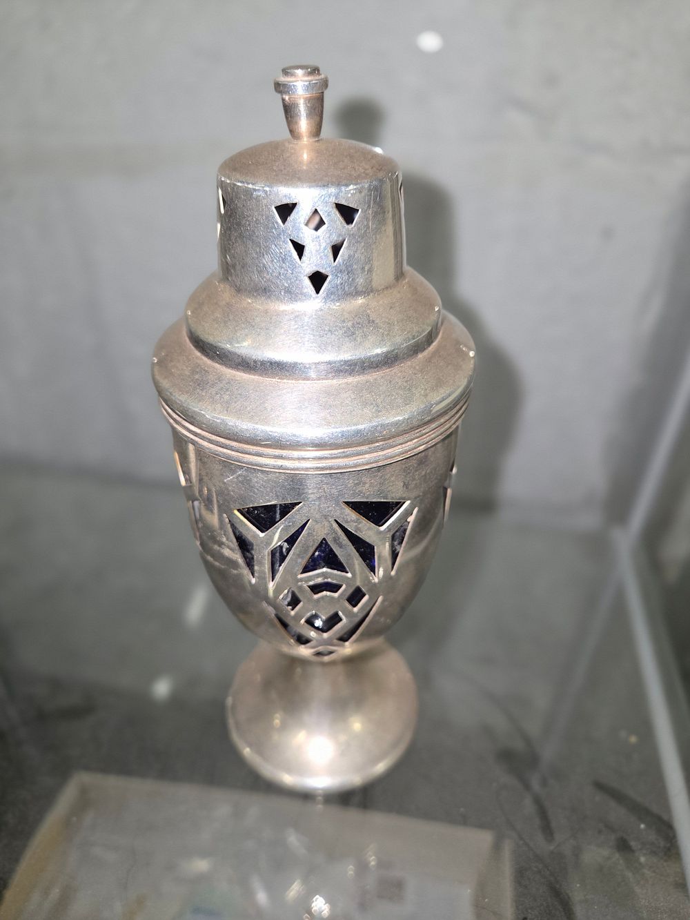 Lot 604 – Silver Toned Pierced Sugar Caster with Blue Glass Liner