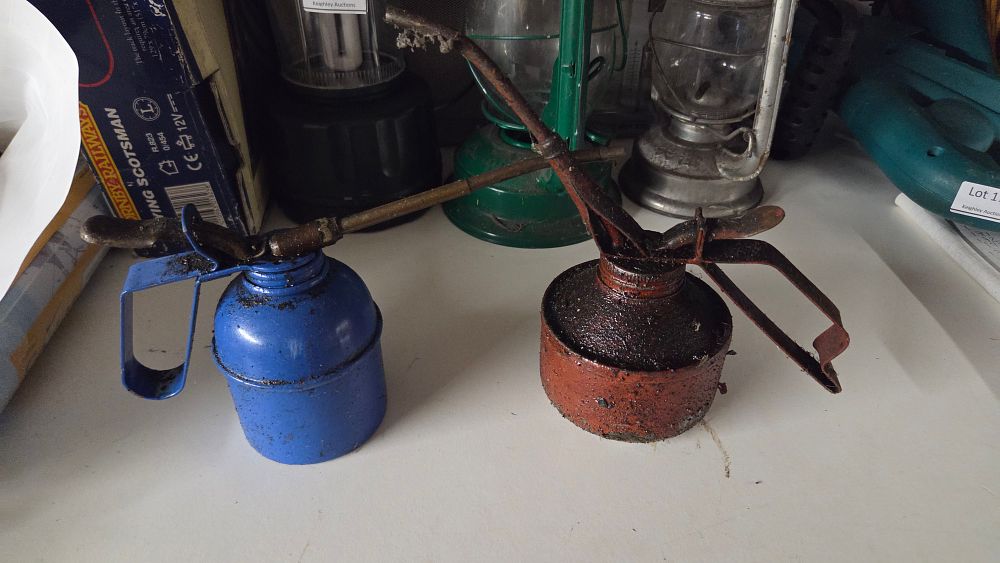 Lot 180 – Two vintage metal pump-action oil cans