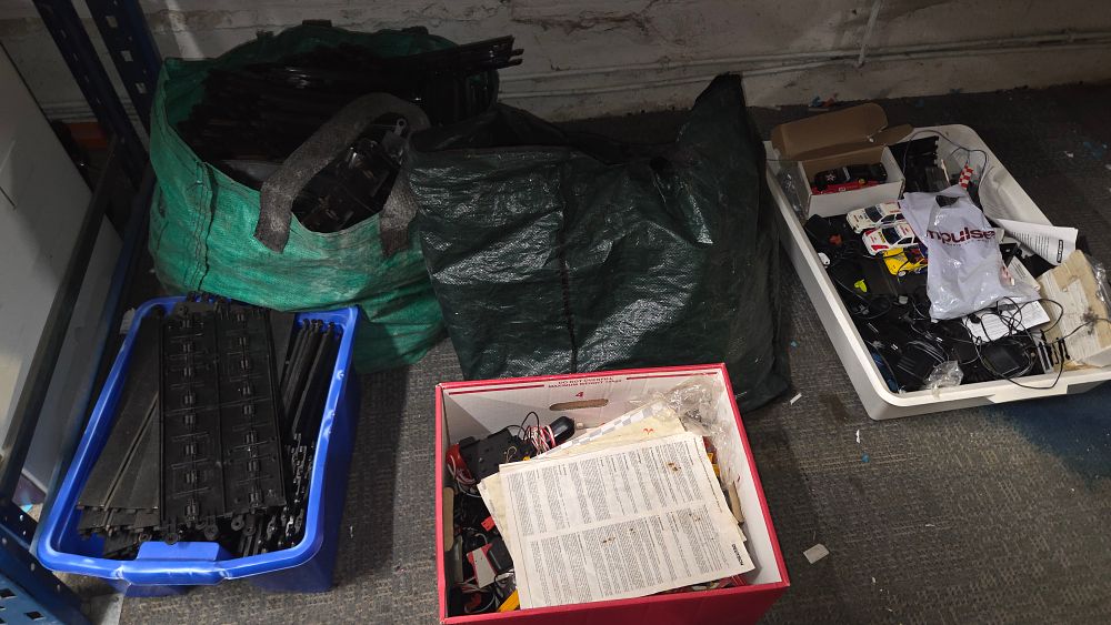 Lot 207 – Two Bags and Three Boxes of Slot Car Tracks and Model Cars