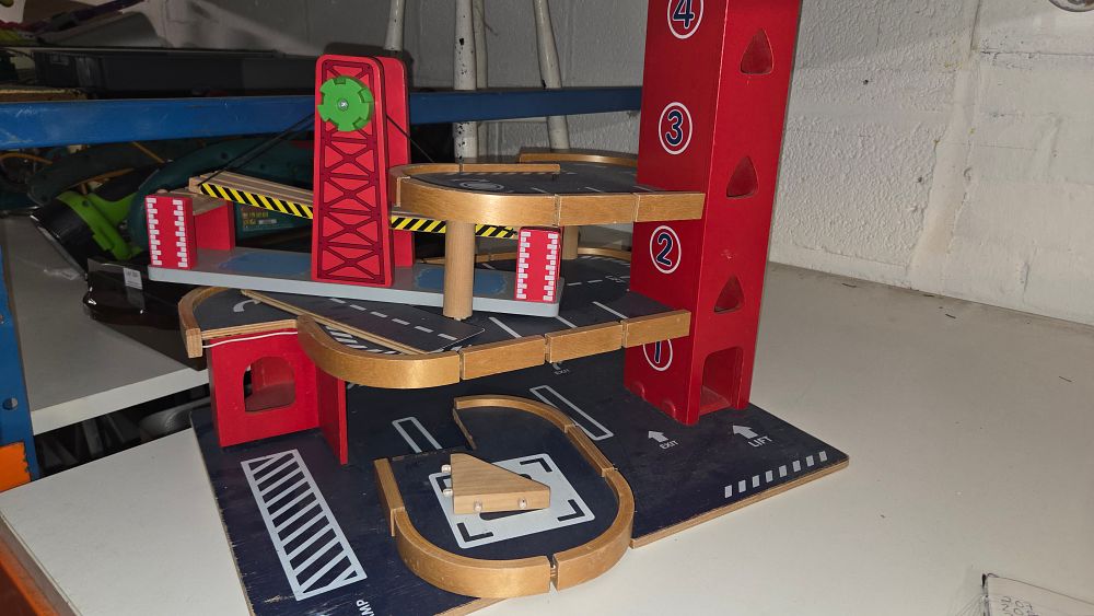 Lot 219 – Hape Gearhead Stunt Garage Wooden Toy Car Parking Lot