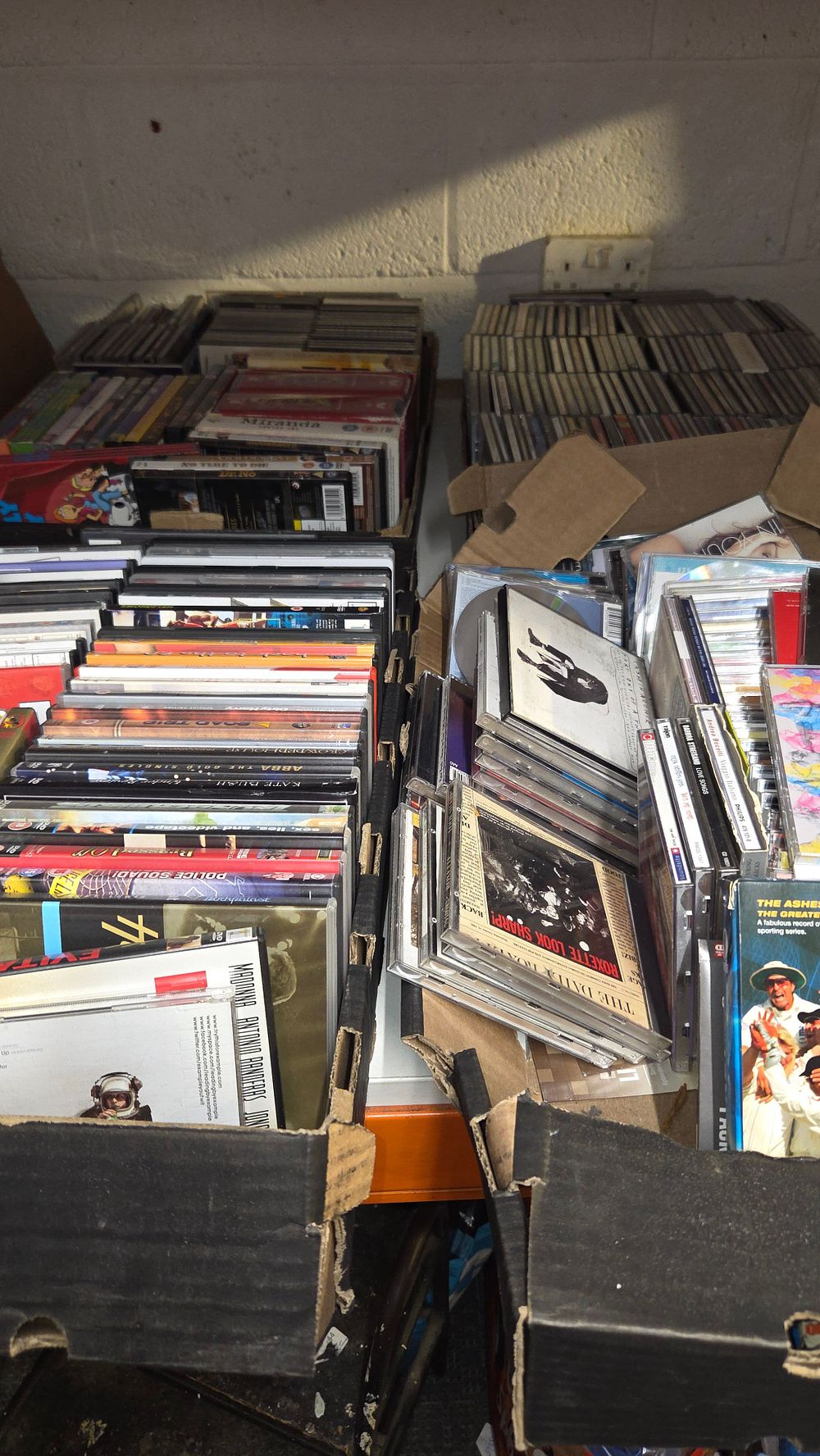 Lot 248 – Four Boxes of Assorted CDs and DVDs