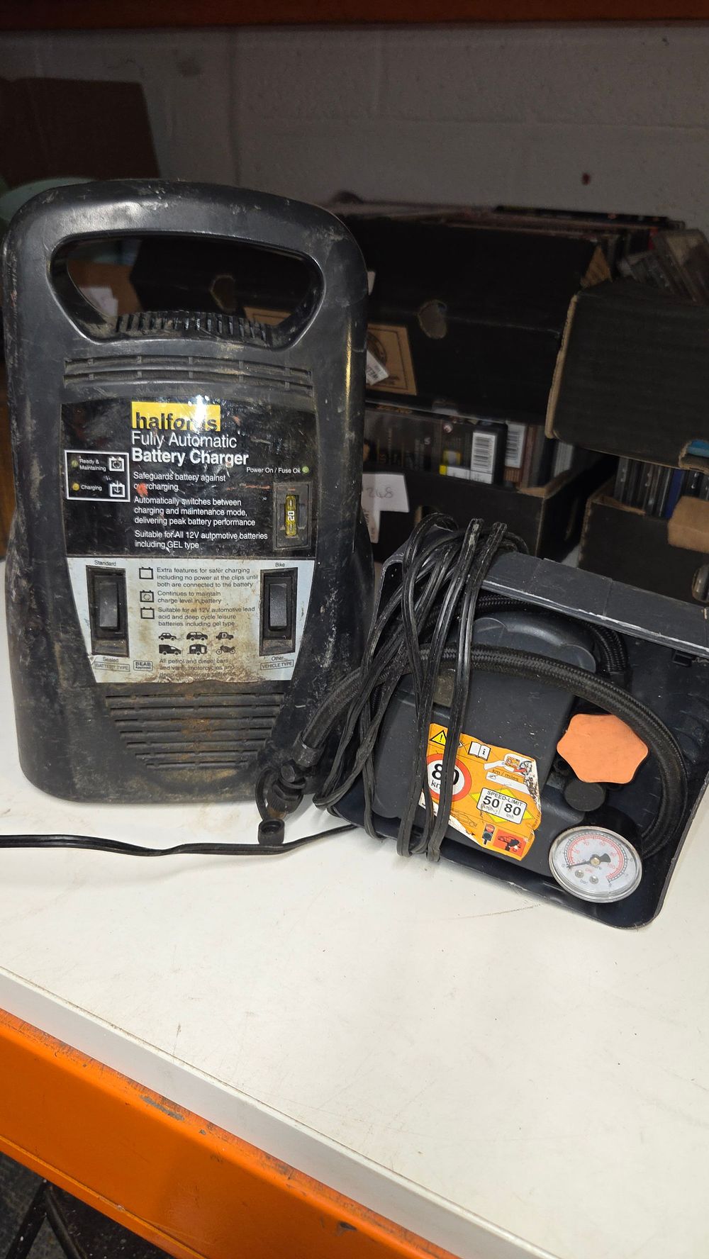 Lot 255 – Two items including a Halfords battery charger and air compressor