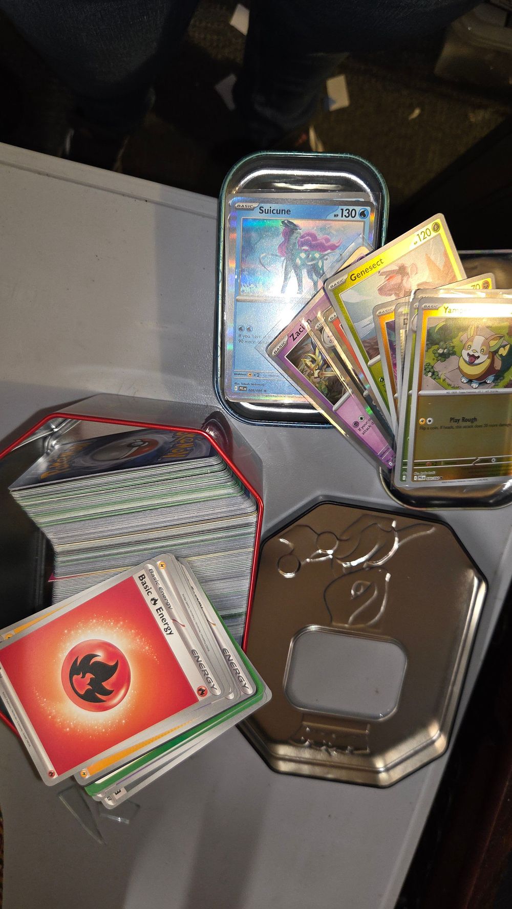 Lot 327 – A Collection of Pokémon Trading Cards and Metal Storage Tins