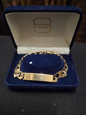 A 9ct Gold curb link identification bracelet 14.05g