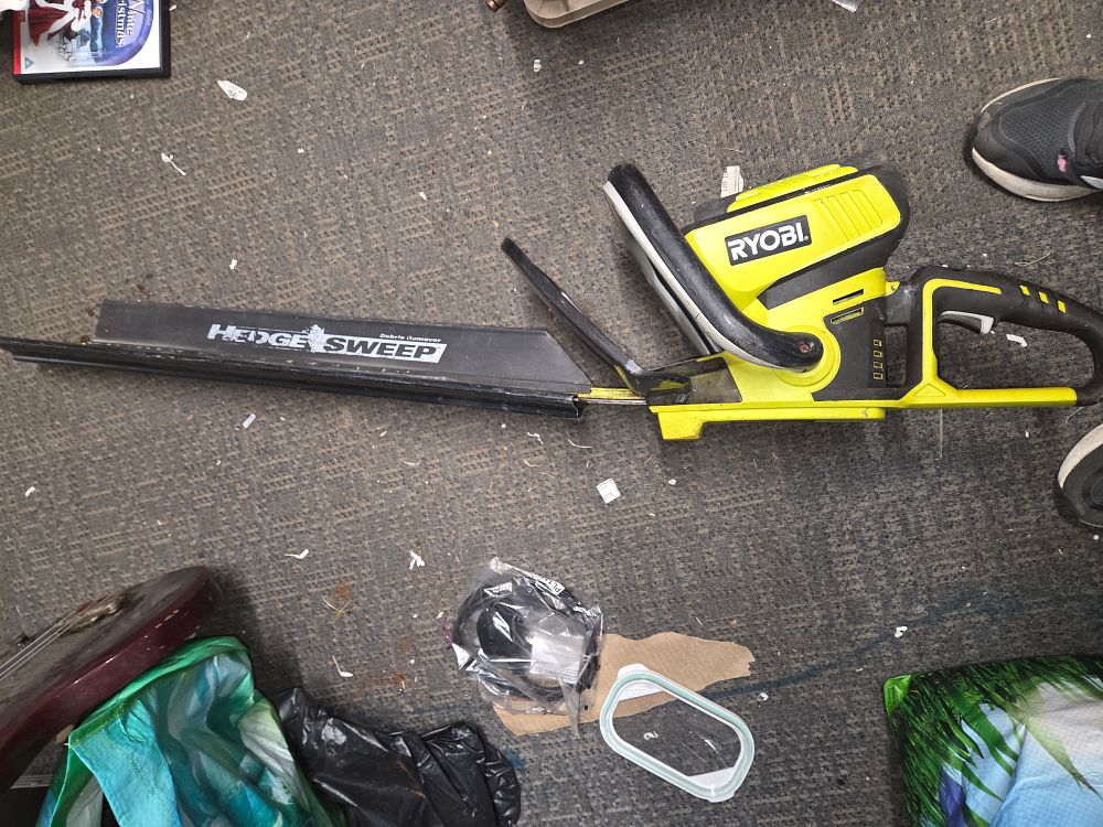 Lot 448 – Ryobi Cordless Hedge Trimmer with Hedge Sweep Attachment
