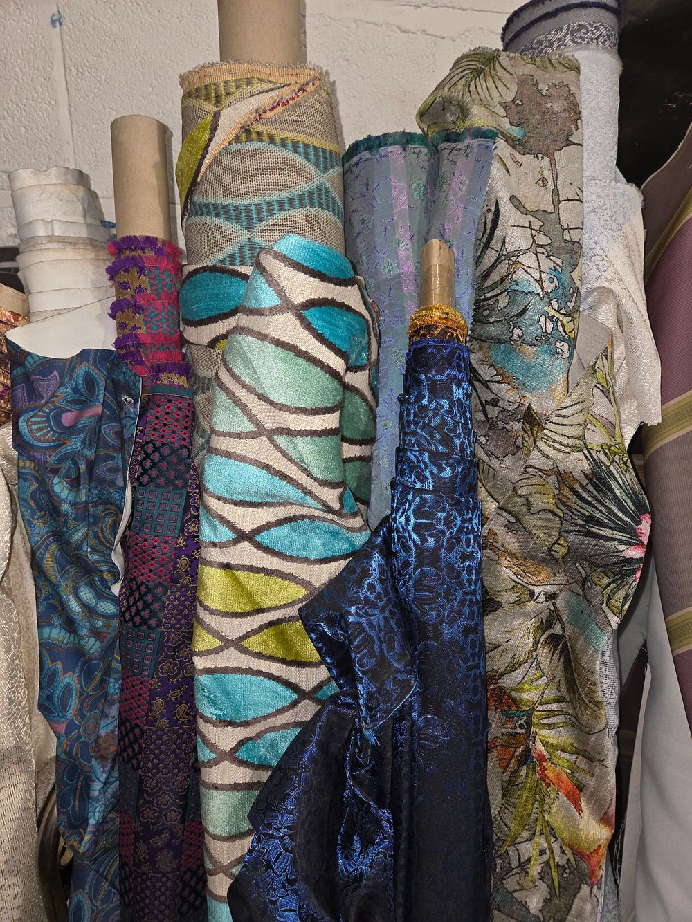 Lot 481 – A Collection of Decorative Fabric Rolls in Various Patterns