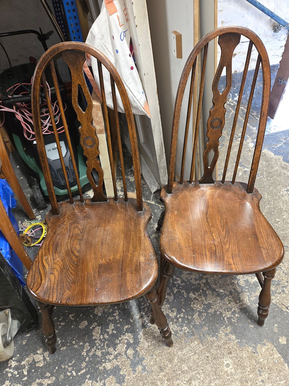 Lot 494 – A Pair of Oak Wheelback Windsor Dining Chairs