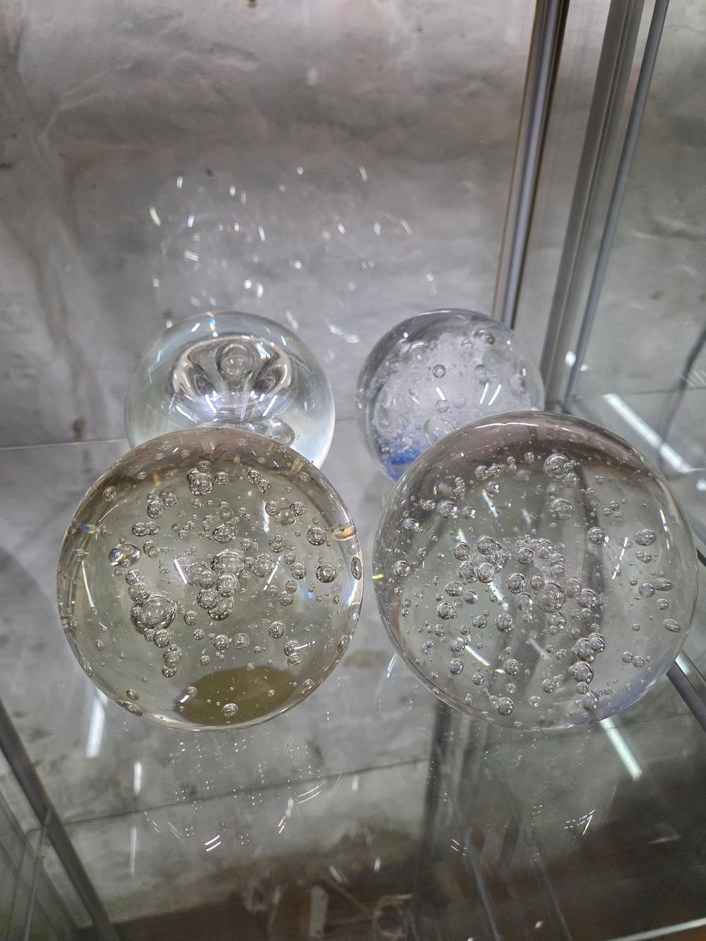 Lot 614 – A Collection of Clear Glass Bubble Paperweights
