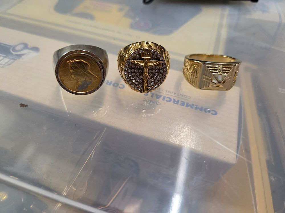Lot 620 – Three gold and silver toned men’s dress rings