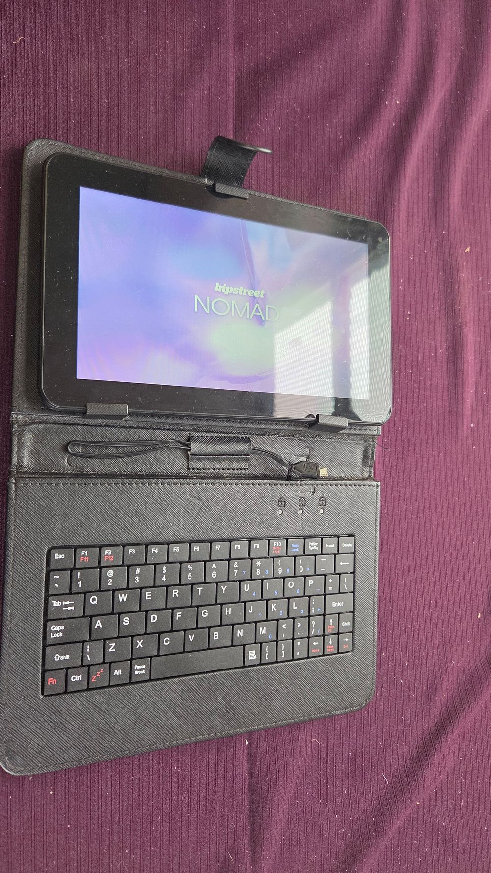 Lot 305 – Nomad, 7-inch Tablet with Keyboard Case powers on