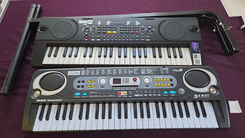 Lot 317 – A Pair of 54-Key Portable Electronic Keyboards, RockJam RJ549 and Academy of Music Models
