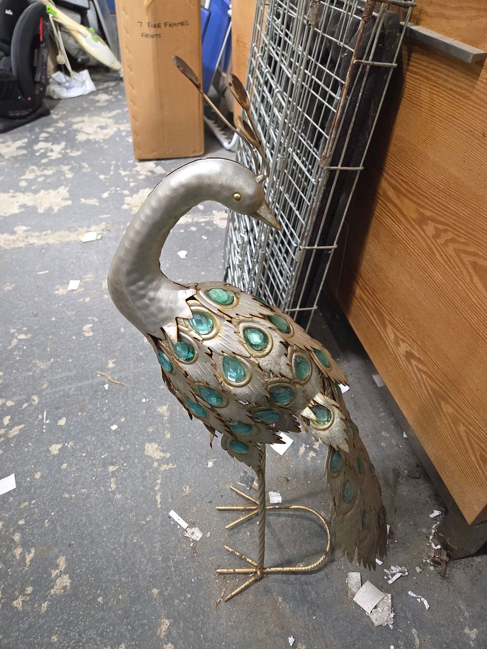 Lot 367 – A Decorative Sheet Metal Peacock Sculpture with Glass Insets