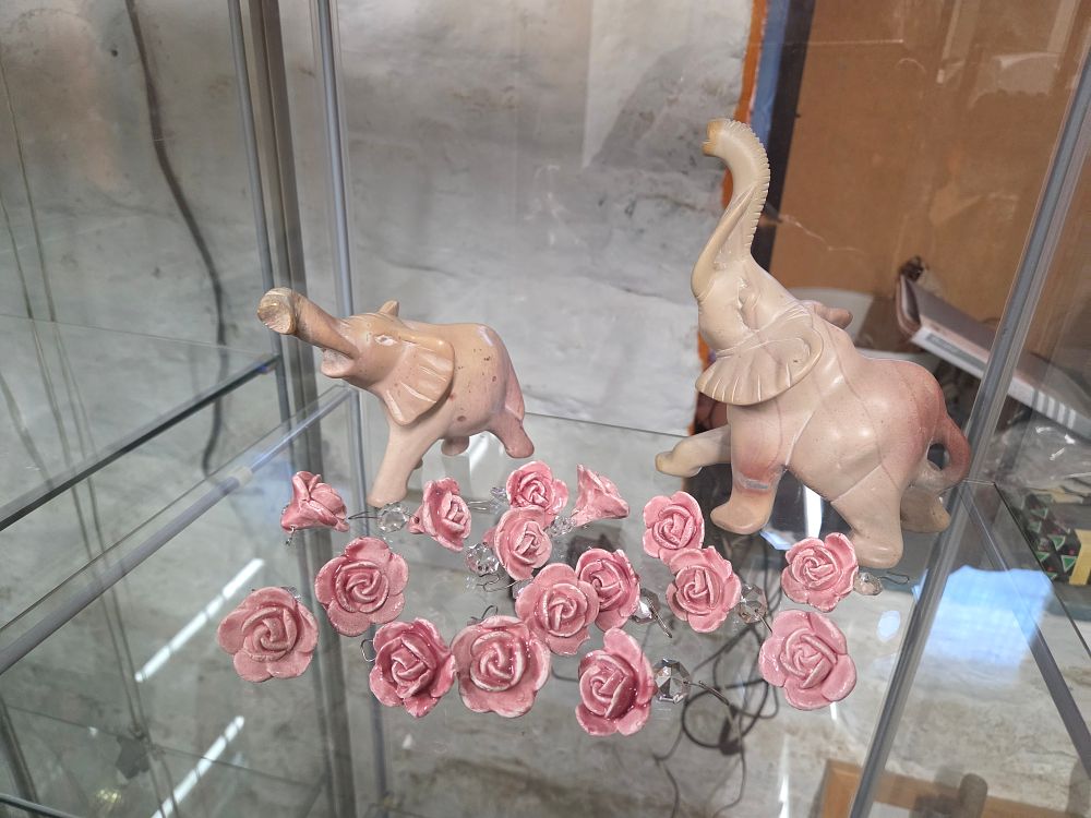 Lot 622 – A Group of Decorative Items Comprising Two Carved Stone Elephants and Ceramic Rose Ornaments