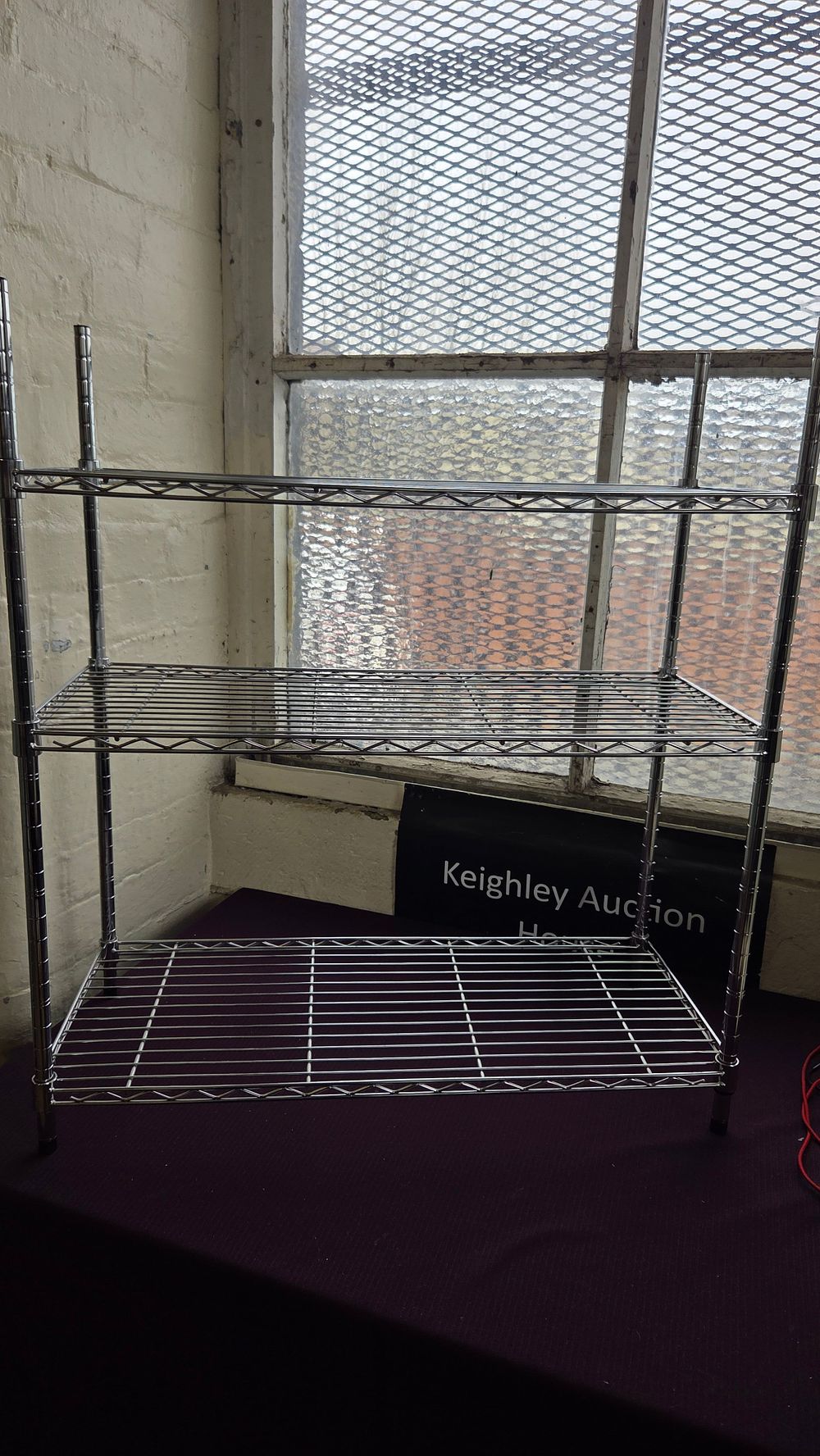 Lot 274 – A Chrome-Plated Steel Wire Three-Tier Adjustable Shelving Unit